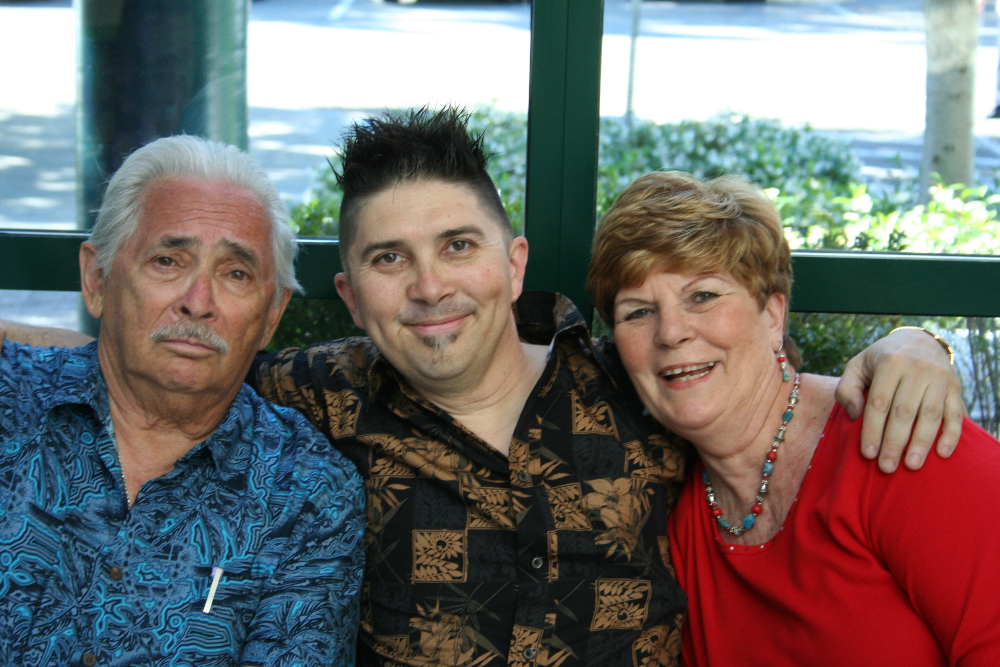 Pol with parents at graduation